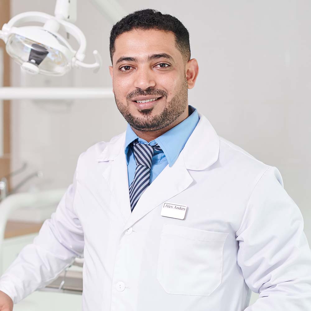 middle-eastern-dentist-posing-by-chair-3WJ4MEV